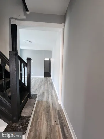 a view of gallery with wooden floor