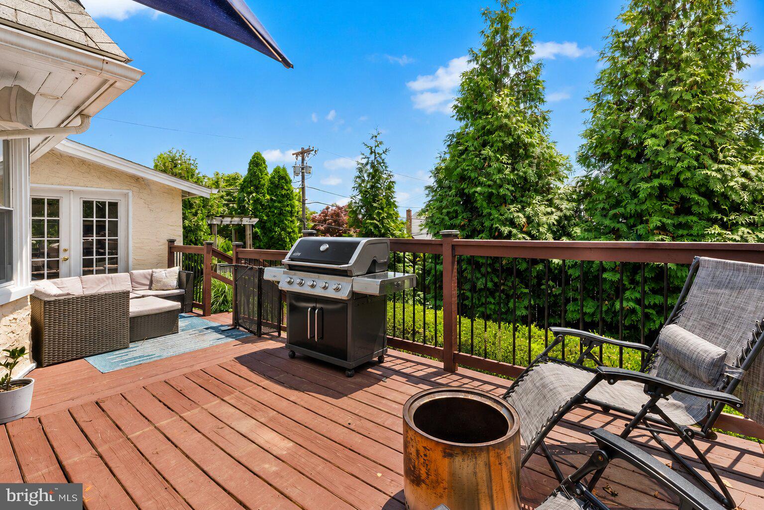 2404 Poplar Road Havertown, PA 19083 - Photo 9 of 40 a view of a patio with table and chairs couches with wooden floor and fence