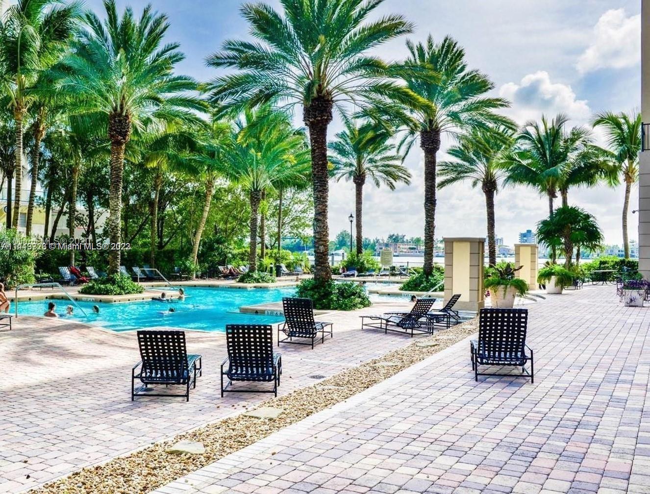 a view of a backyard with sitting area and furniture