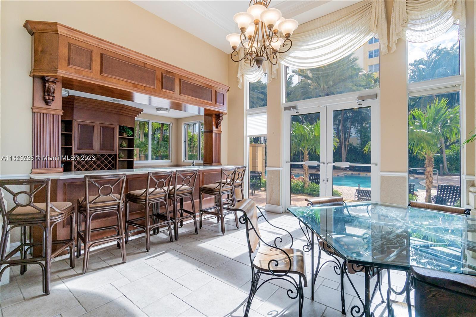 17100 North Bay Road, Unit 1613 Sunny Isles Beach, FL 33160 - Photo 12 of 30 a view of a dining room with furniture window and outside view
