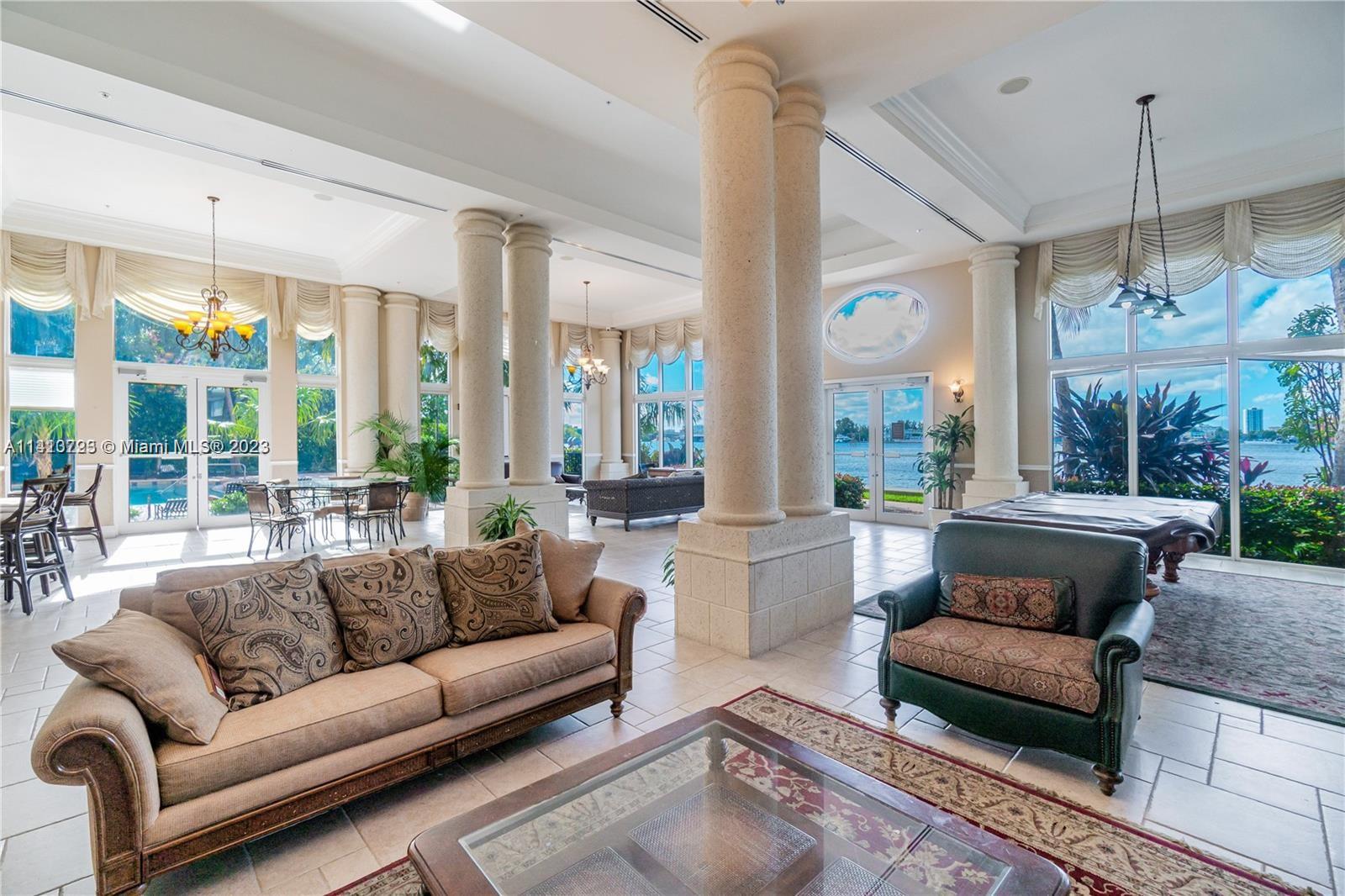 17100 North Bay Road, Unit 1613 Sunny Isles Beach, FL 33160 - Photo 15 of 30 a living room with furniture and a large window