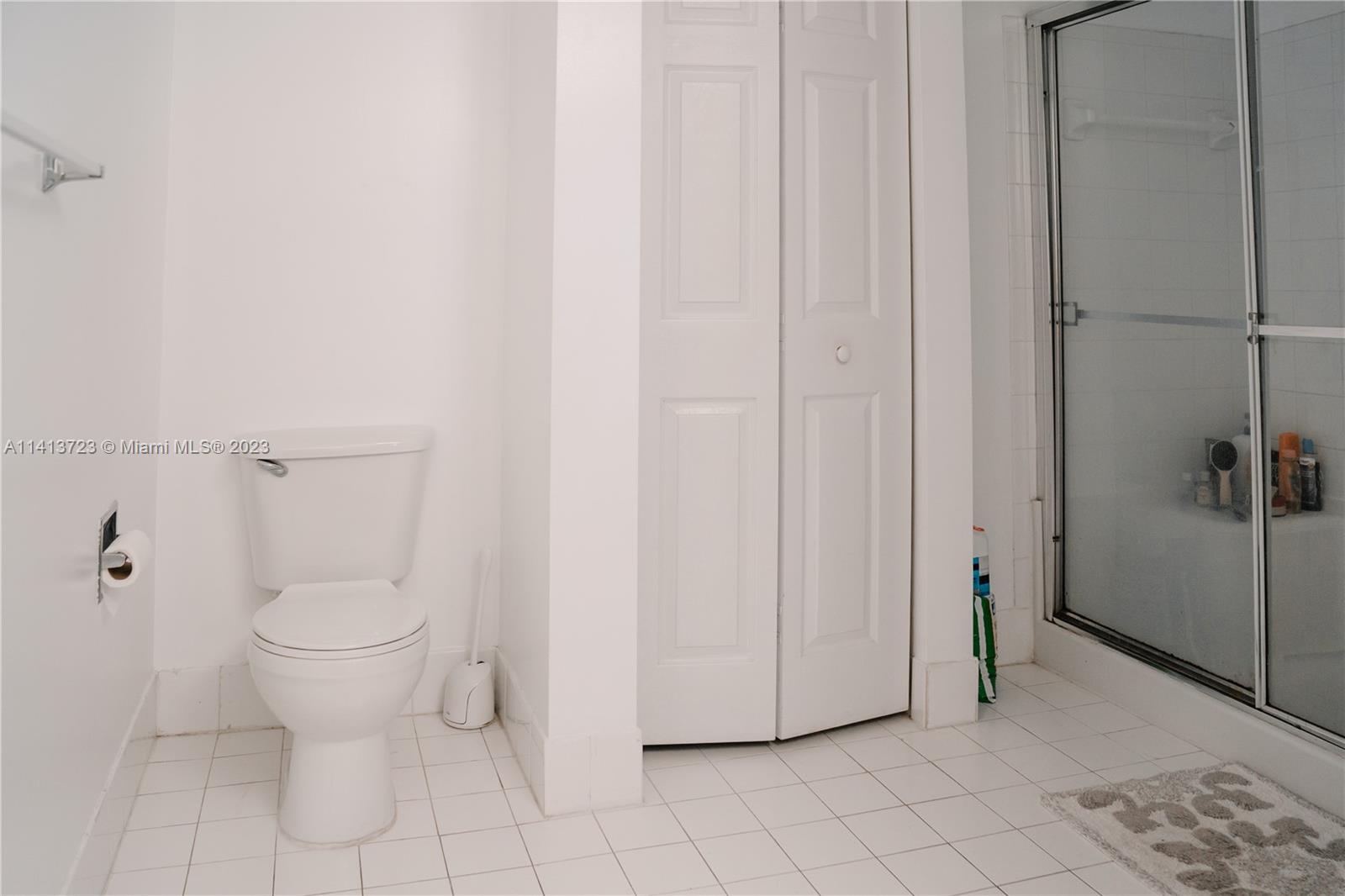 17100 North Bay Road, Unit 1613 Sunny Isles Beach, FL 33160 - Photo 18 of 30 a bathroom with a toilet and a shower