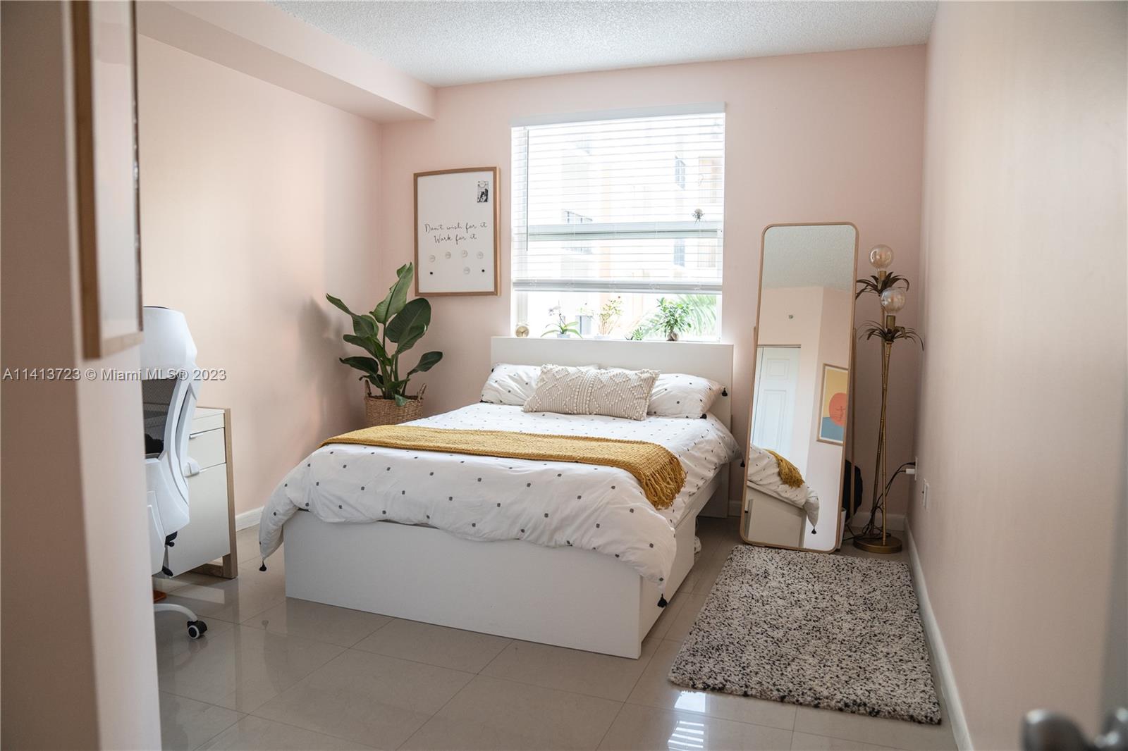 17100 North Bay Road, Unit 1613 Sunny Isles Beach, FL 33160 - Photo 27 of 30 a bed sitting in a bedroom next to a window