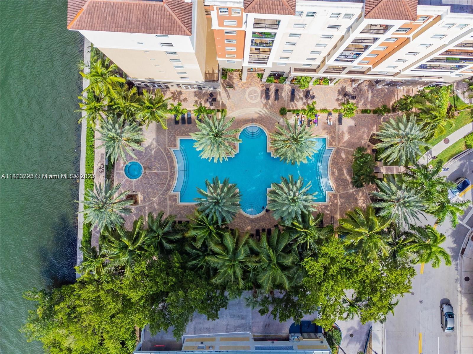 17100 North Bay Road, Unit 1613 Sunny Isles Beach, FL 33160 - Photo 7 of 30 a vase of flowers sitting on a wooden floor