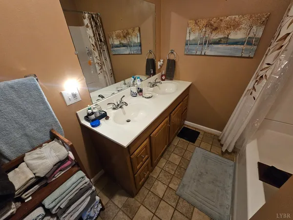a bathroom with a sink and mirror