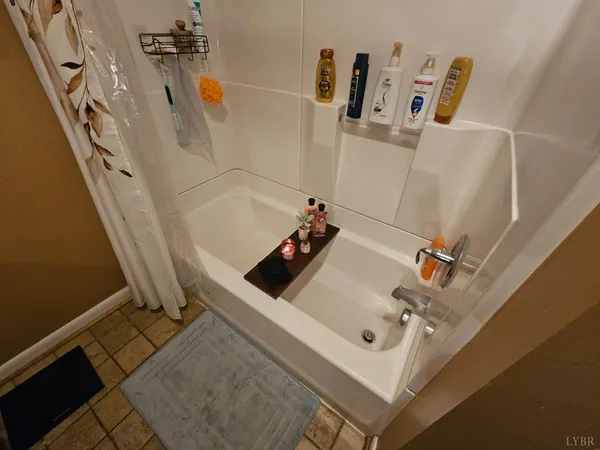 a kitchen with granite countertop a stove top oven a sink dishwasher and a refrigerator