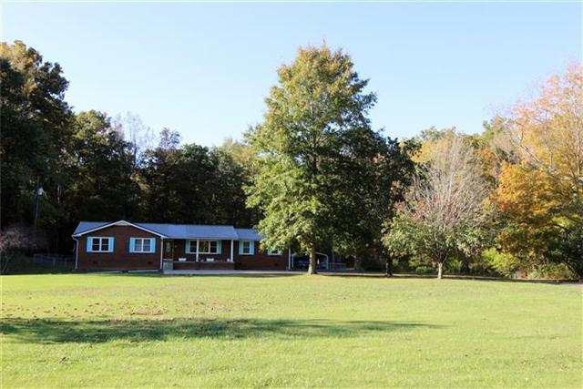232 Daniel Road Dover, TN 37058 - Photo 1 of 20 Beautiful brick home with numerous upgrades, sitting on 4.59 acres+/-.