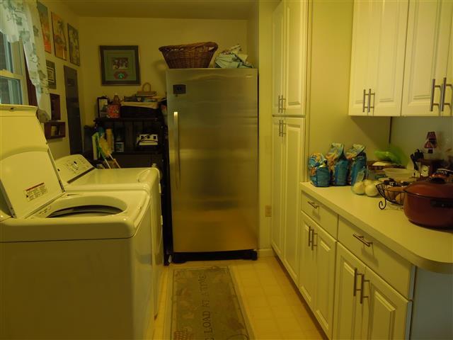 232 Daniel Road Dover, TN 37058 - Photo 18 of 20 Utility room with good cabinet space and double closet.