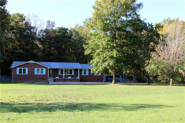 232 Daniel Road Dover, TN 37058 - Photo 2 of 20 Large level front lawn, asphalt drive with a wet weather creek to the side.