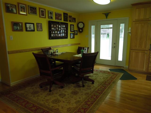 232 Daniel Road Dover, TN 37058 - Photo 8 of 20 Dining area of greatroom. Chair rail, back door with side lights that lead out to the covered patio.