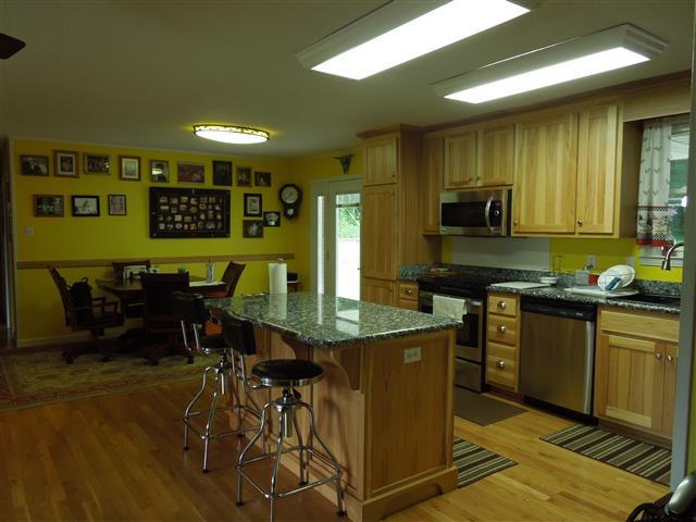 232 Daniel Road Dover, TN 37058 - Photo 9 of 20 Kitchen-Dining Area together. Beautiful new kitchen with hickory cabinets-granite countertops – new s.s. appliances.