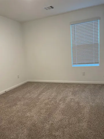 a view of a room that has a window in it