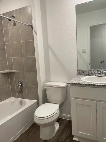 a bathroom with a sink a toilet and a bathtub