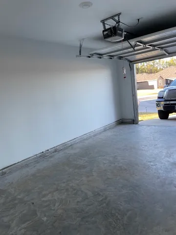 a view of a room with rack and a wooden floor