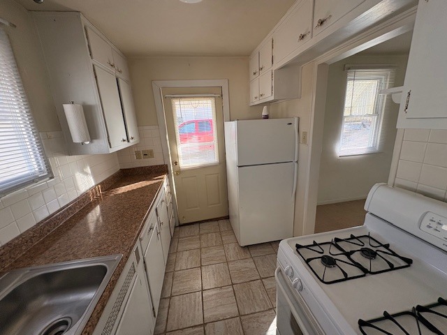 968 40th Street Moline, IL 61265 - Photo 9 of 19 a kitchen with a refrigerator and a stove