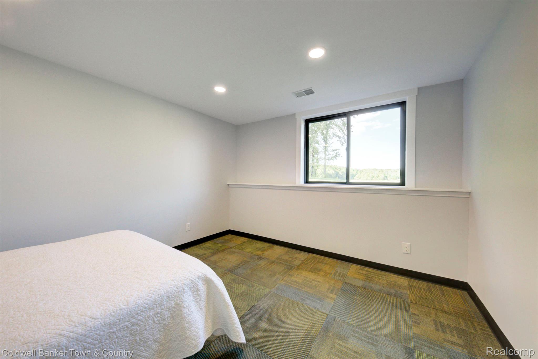 5465 East Allen Road Howell, MI 48855 - Photo 47 of 81 Lower level bedroom with Lakeview