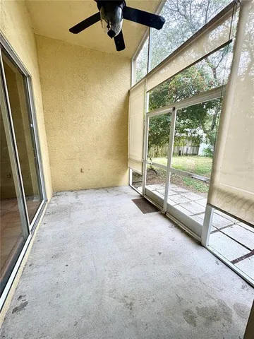 a view of an empty room with a balcony