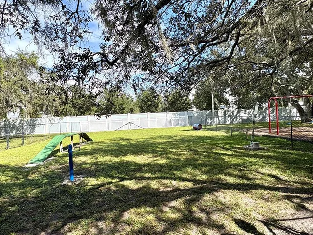 a view of yard with swimming pool