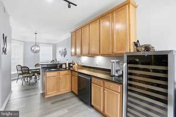 a kitchen with a stove a sink and cabinets