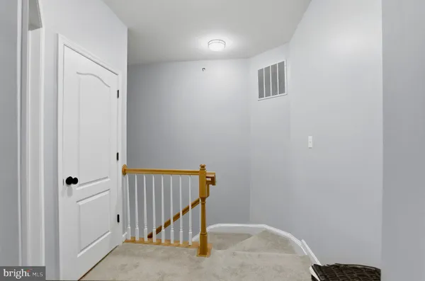 a view of a hallway with staircase