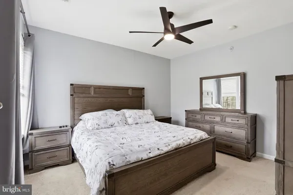 a bedroom with a bed and furniture