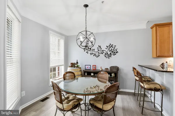 a view of a dining room with furniture and window