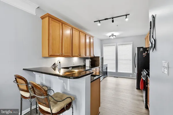a kitchen with a sink appliances and cabinets
