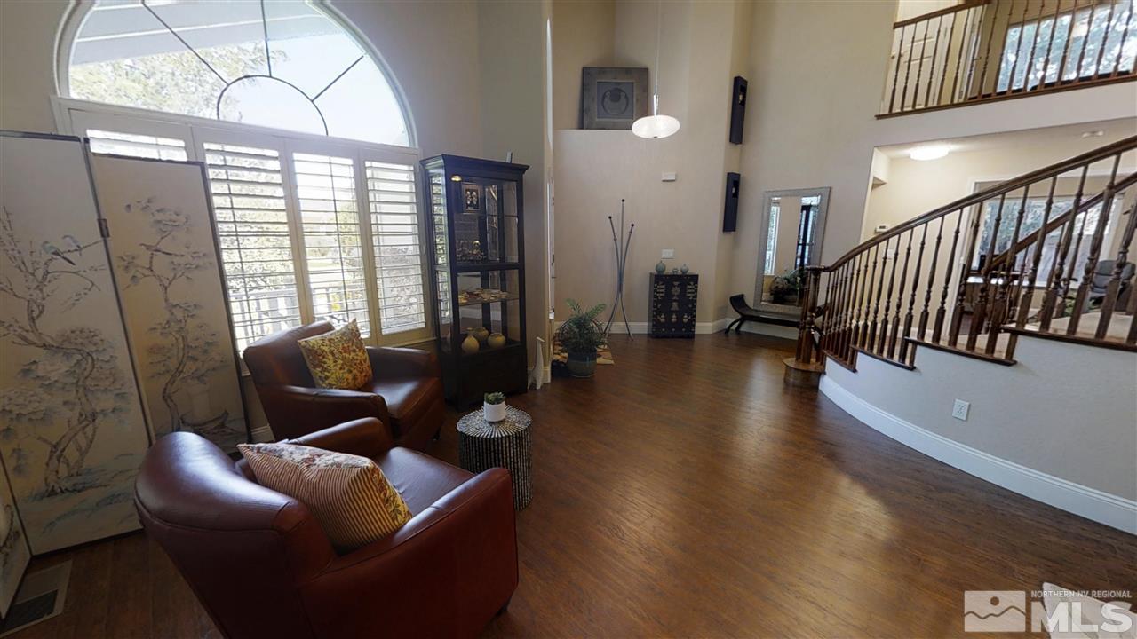 1970 Honey Ridge Drive Reno, NV 89511 - Photo 12 of 25 a living room with furniture and a floor to ceiling window