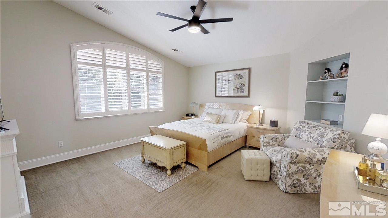 1970 Honey Ridge Drive Reno, NV 89511 - Photo 13 of 25 a spacious bedroom with a bed and a window