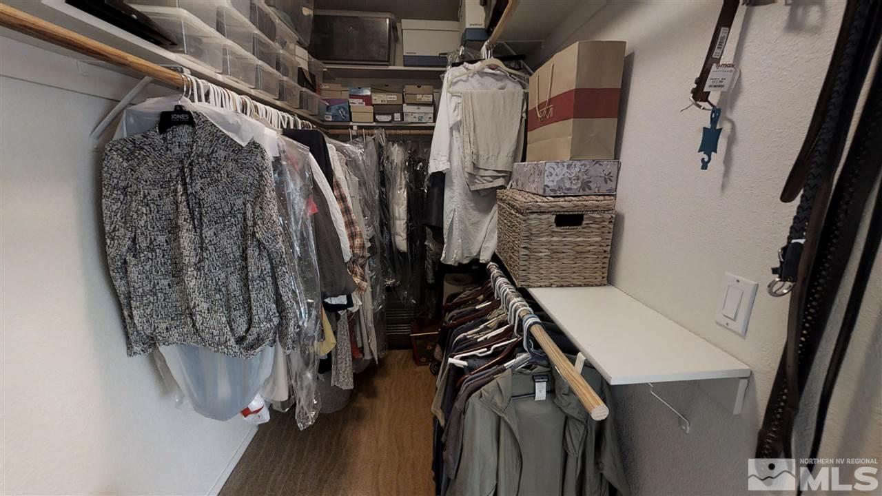 1970 Honey Ridge Drive Reno, NV 89511 - Photo 16 of 25 a view of walk in closet with clothes and shoes