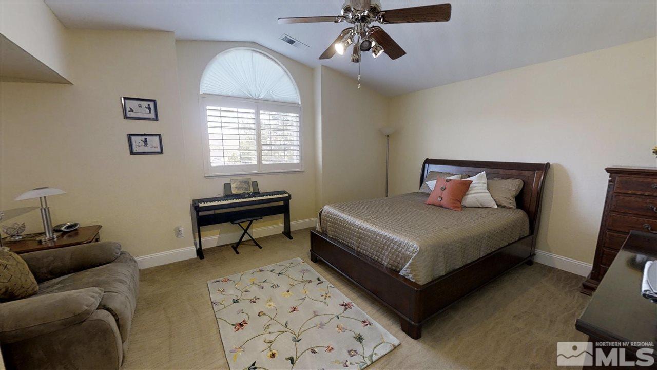 1970 Honey Ridge Drive Reno, NV 89511 - Photo 17 of 25 a bedroom with a bed and a couch