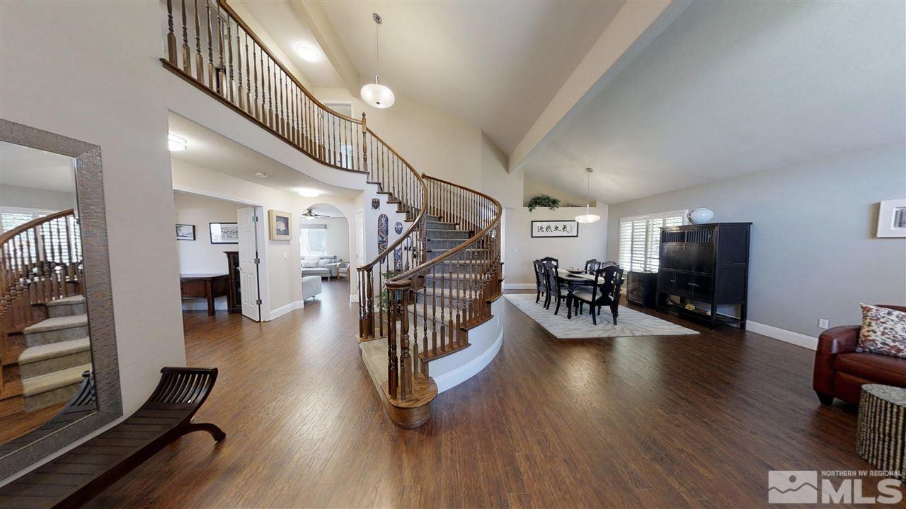 1970 Honey Ridge Drive Reno, NV 89511 - Photo 2 of 25 a hallway with wooden floors and white walls