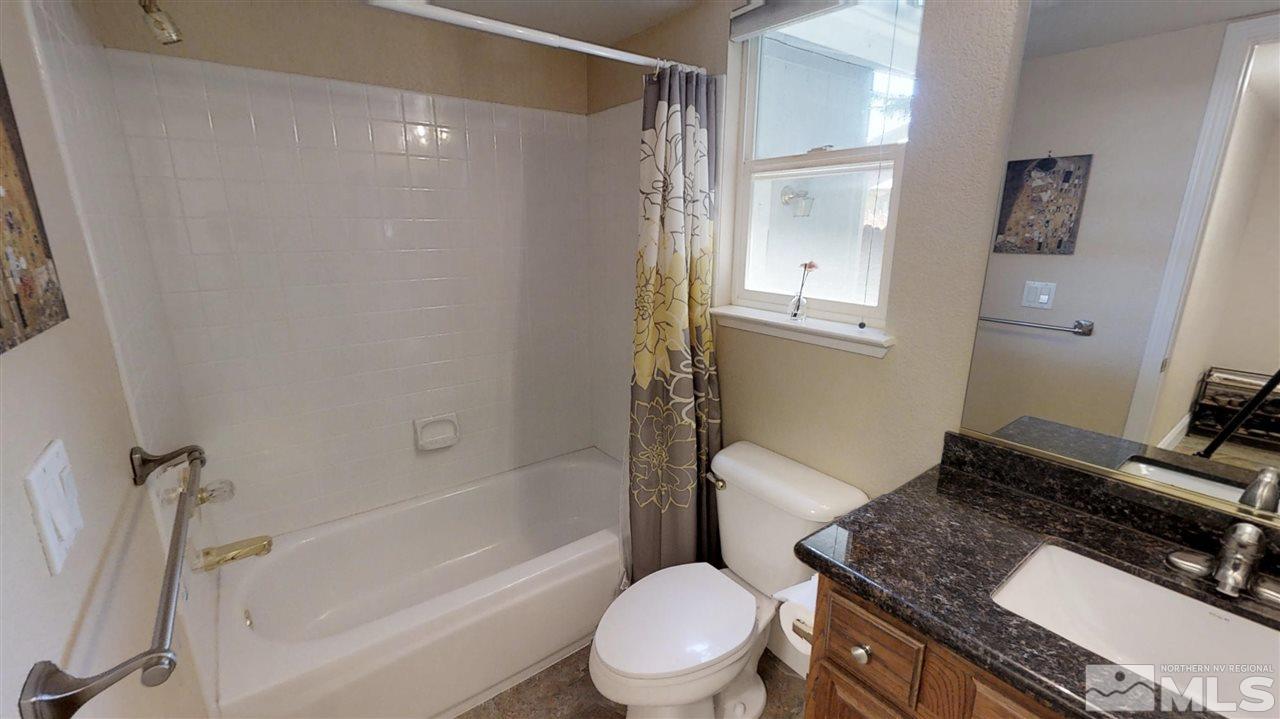 1970 Honey Ridge Drive Reno, NV 89511 - Photo 24 of 25 a bathroom with a granite countertop sink toilet and shower