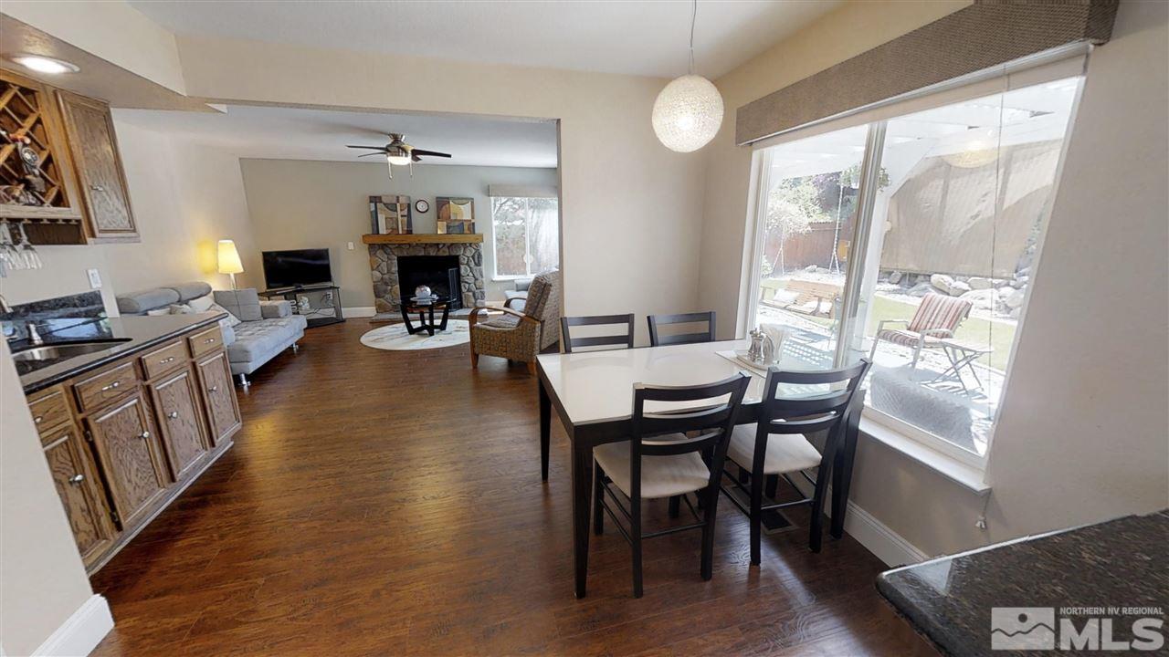 1970 Honey Ridge Drive Reno, NV 89511 - Photo 6 of 25 a view of a dining room with furniture window and wooden floor