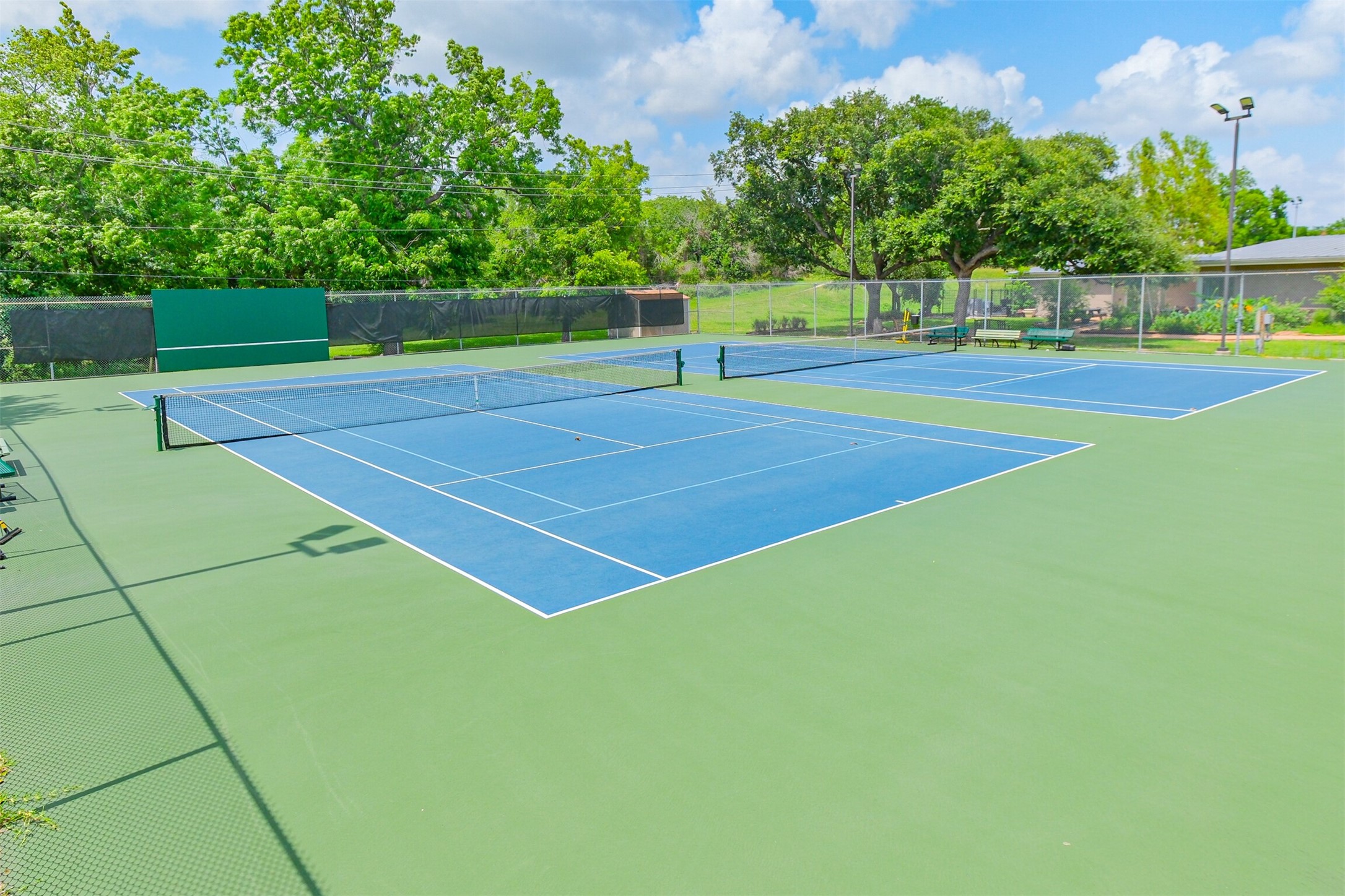 1007 Arrow Hill Road Houston, TX 77077 - Photo 43 of 50 a view of an outdoor space and tennis court