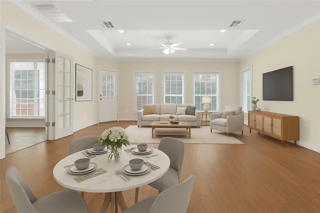 a view of a dining room with furniture and wooden floor