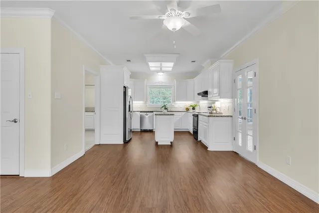 a view of kitchen with wooden floor