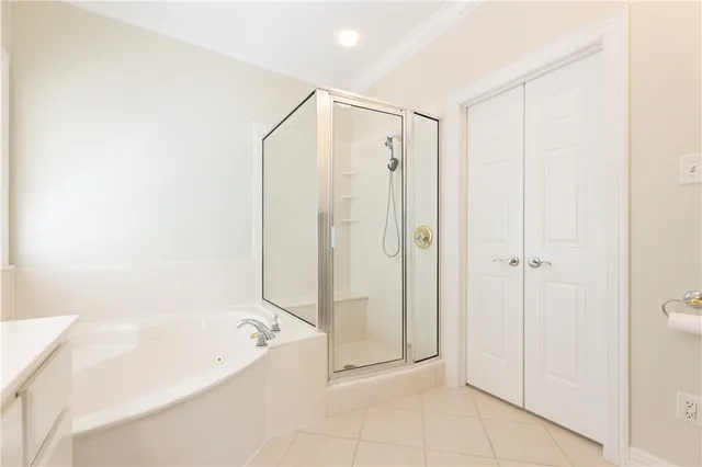 a bathroom with a shower and a tub