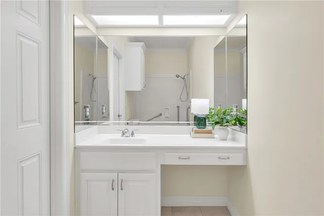 a bathroom with a sink and a mirror