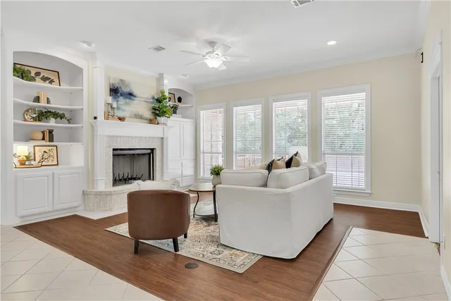 a living room with furniture and a fireplace