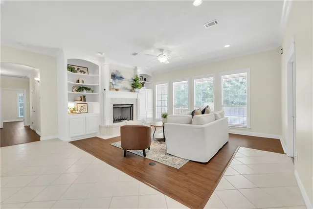 a living room with furniture and a fireplace