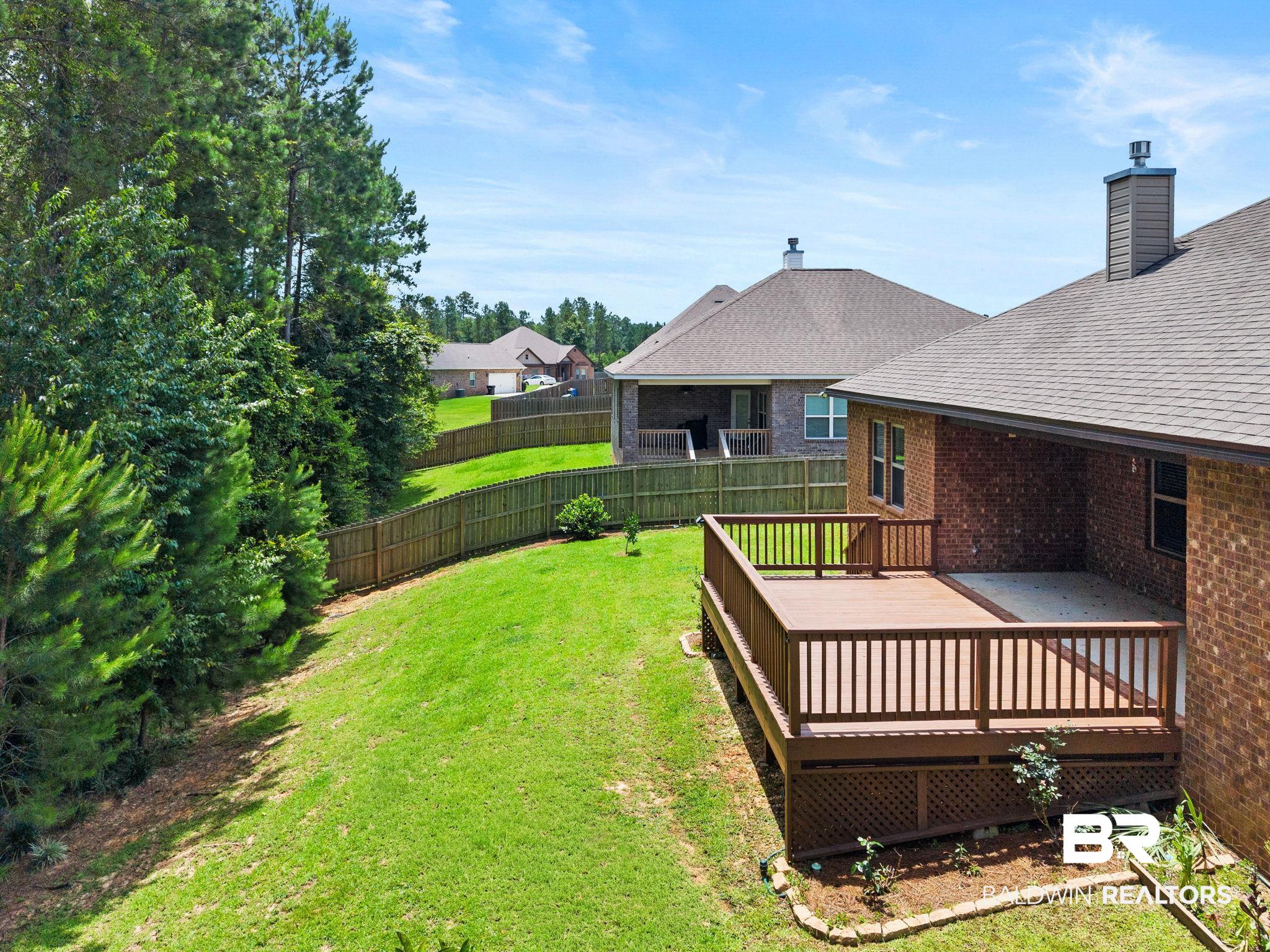 31350 Hoot Owl Road Daphne, AL 36527 - Photo 85 of 94 Expansive backyard featuring a multi-level wooden deck and an attached concrete patio