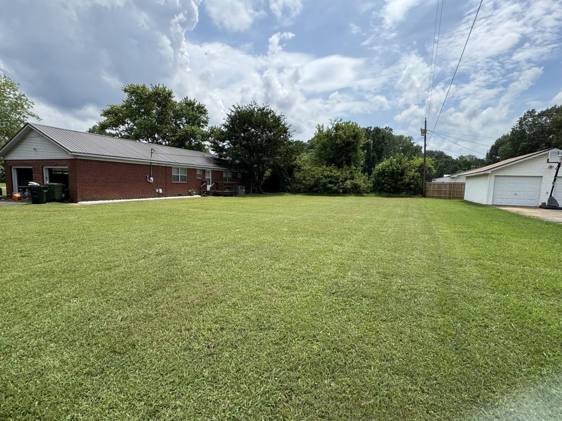 2631 Highway 51 Ripley, TN 38063 - Photo 17 of 17 View of grassy yard featuring a garage