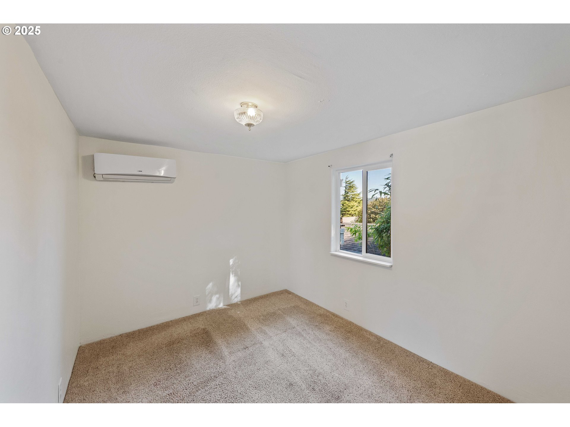 584 Exchange Street North Bend, OR 97459 - Photo 18 of 48 a view of an empty room with a window