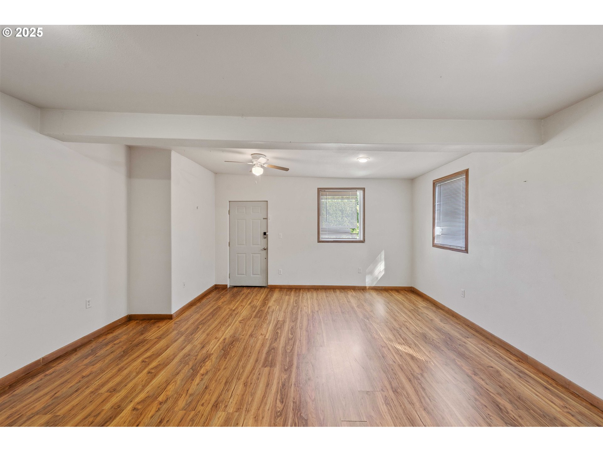 584 Exchange Street North Bend, OR 97459 - Photo 27 of 48 a view of an empty room and wooden floor
