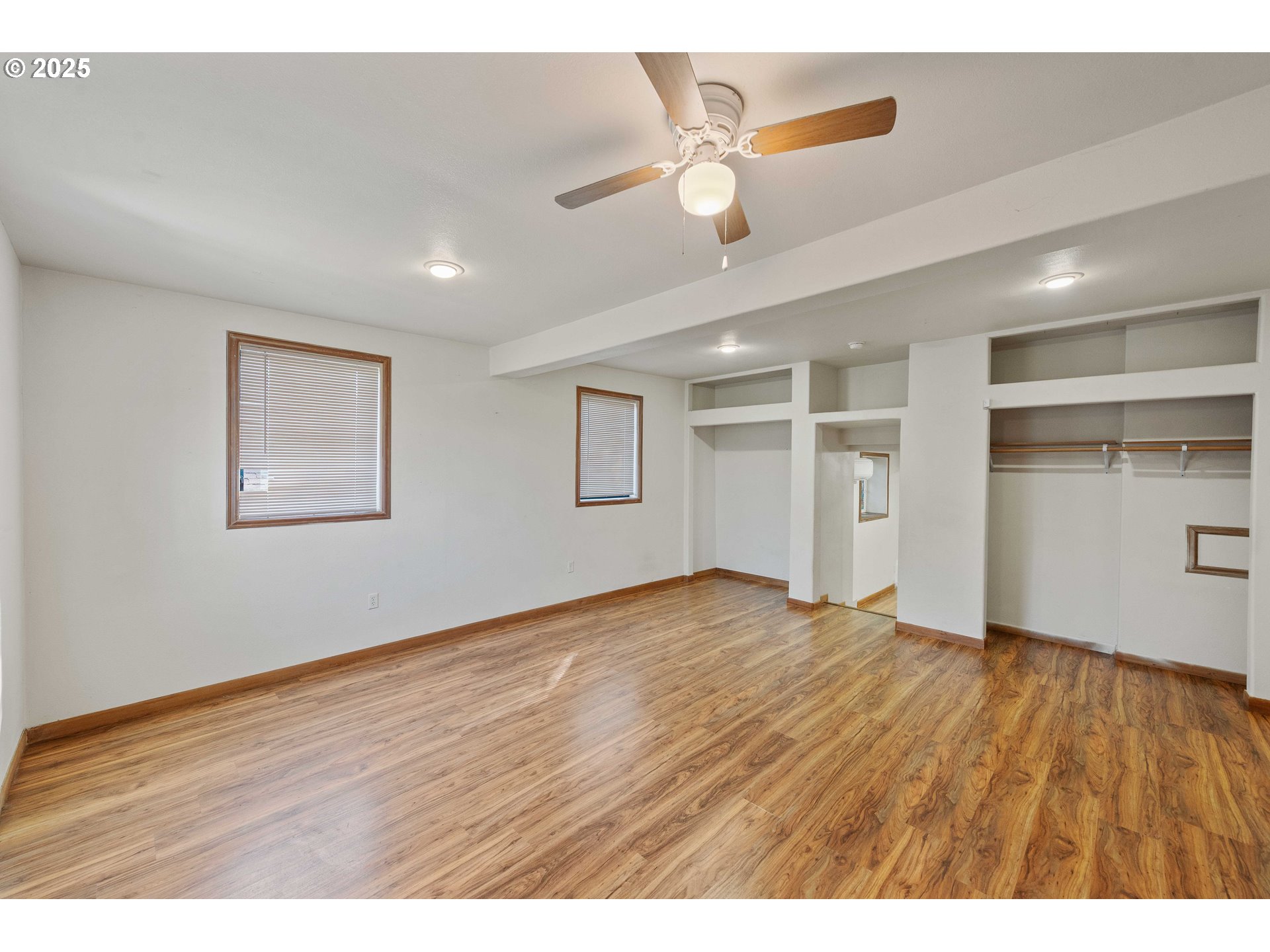 584 Exchange Street North Bend, OR 97459 - Photo 28 of 48 a view of an empty room with wooden floor