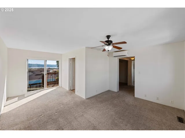 a view of a livingroom with a ceiling fan