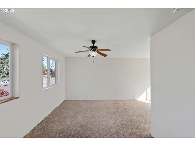 a view of empty room with windows