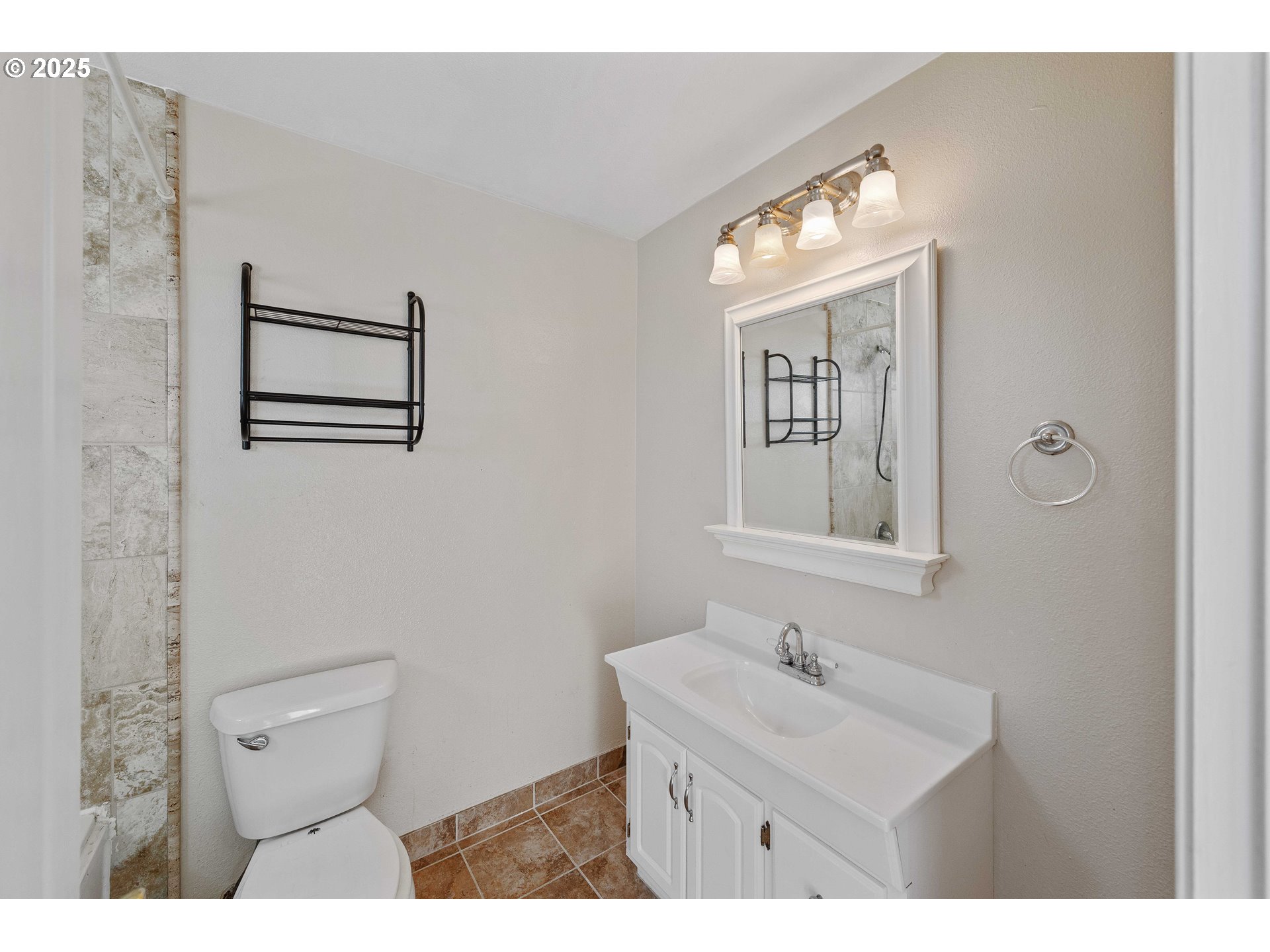584 Exchange Street North Bend, OR 97459 - Photo 35 of 48 a bathroom with a toilet sink and mirror
