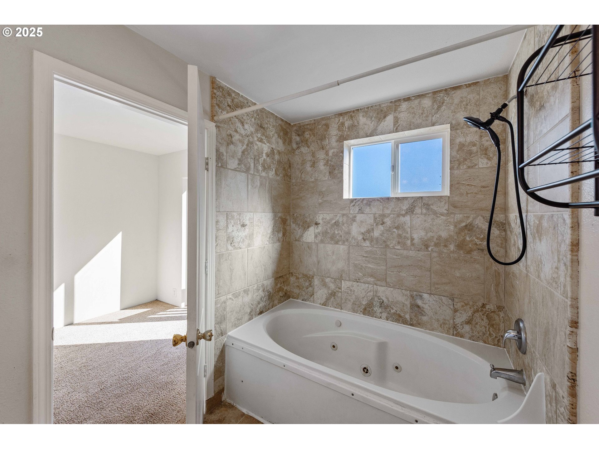 584 Exchange Street North Bend, OR 97459 - Photo 36 of 48 a bathroom with a bath tub and a shower